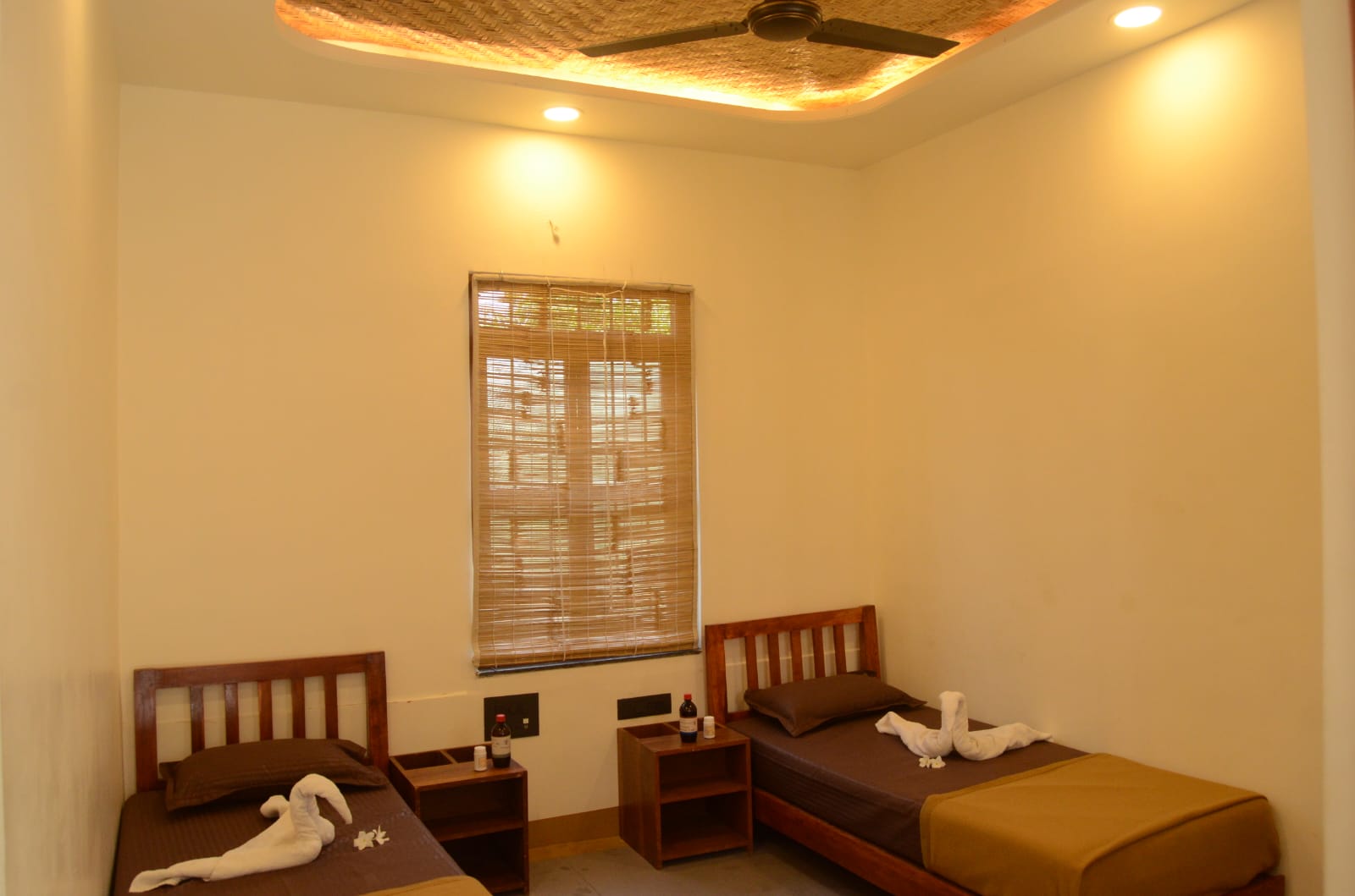 Twin-bed guest room at Tapasya Health & Wellness